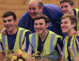 performance coach with young people smiling