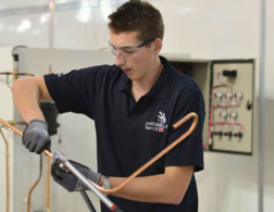 young person competing in plumbing