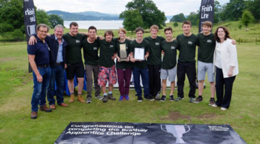 group shot of people holding a plaque