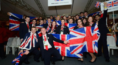 team uk group shot with union jack