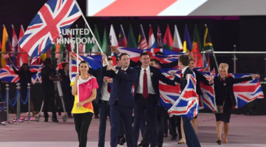 teamuk walking and holding union jack flag