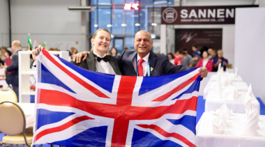 Collette at WorldSkills Kazan 2019 holding a union jack flag