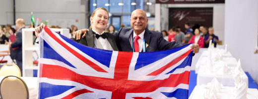 Collette at WorldSkills Kazan 2019 holding a union jack flag