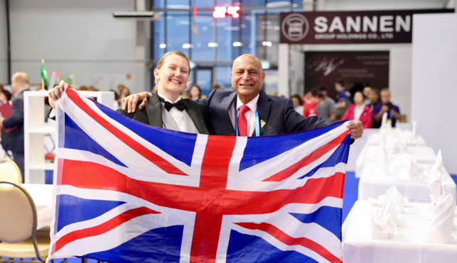 Collette at WorldSkills Kazan 2019 holding a union jack flag