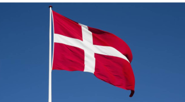 danish flag against blue sky