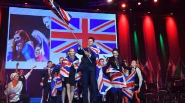 Photo of competitors carrying UK flags on stage at WorldSkills Gothenburg 2016