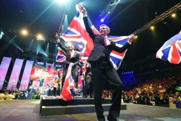 Photo of competitors carrying UK flags on stage at WorldSkills London 2011