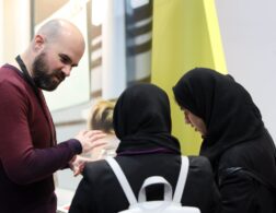 man speaking to young people