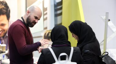 man speaking to young people