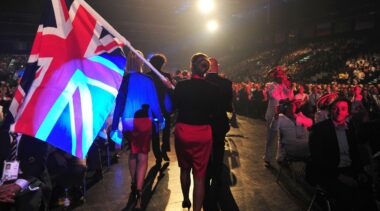 Photo of competitors carrying UK flags on stage at WorldSkills Leipzig 2013