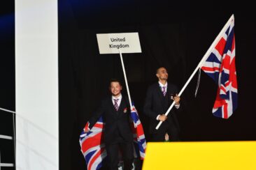 Photo of competitors carrying UK flags on stage at WorldSkills Leipzig 2013