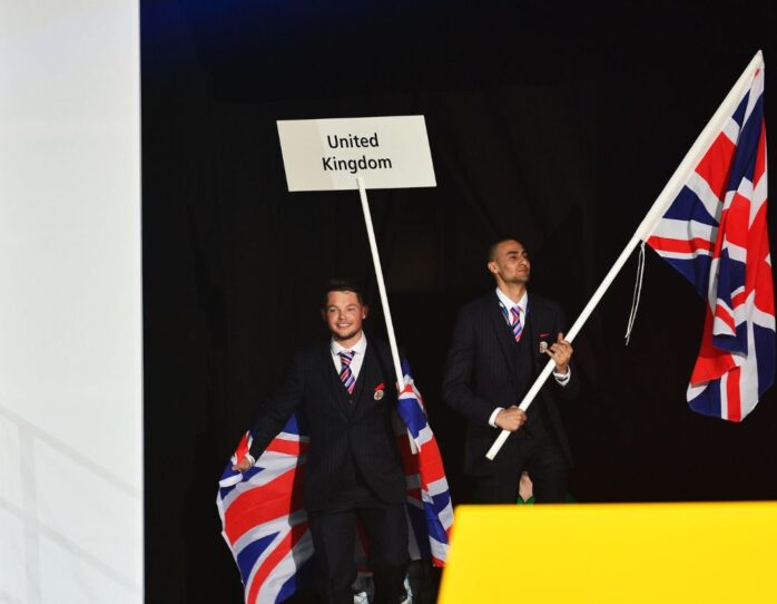 Photo of competitors carrying UK flags on stage at WorldSkills Leipzig 2013