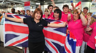 Photo of competitor with flag and supporters in WorldSkills Leipzig 2013