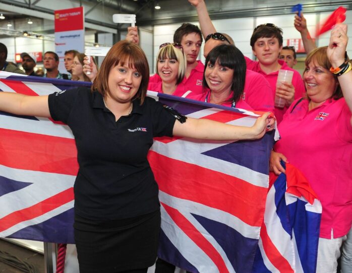 Photo of competitor with flag and supporters in WorldSkills Leipzig 2013