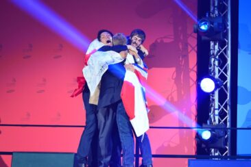 Photo of competitors on stage with flag at WorldSkills Leipzig 2013