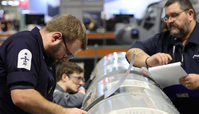 Young person competing in aeronautical engineering mechanical competition