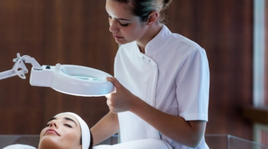 Photo of a beauty therapist giving a facial