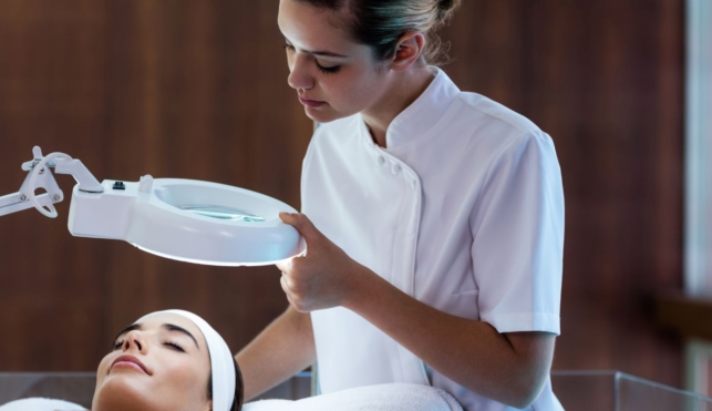 Photo of a beauty therapist giving a facial