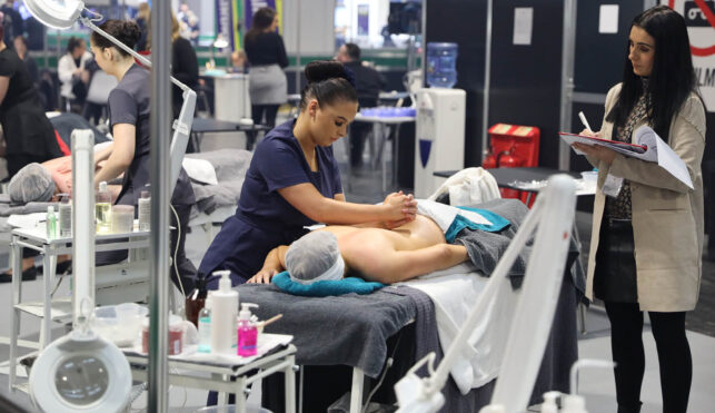 Young people competing in Beauty Therapy Practitioner competition