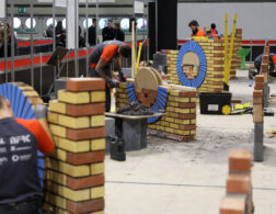 Young people competing in Bricklaying competition