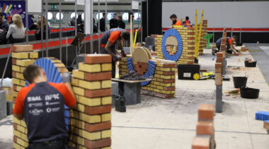 Young people competing in Bricklaying competition