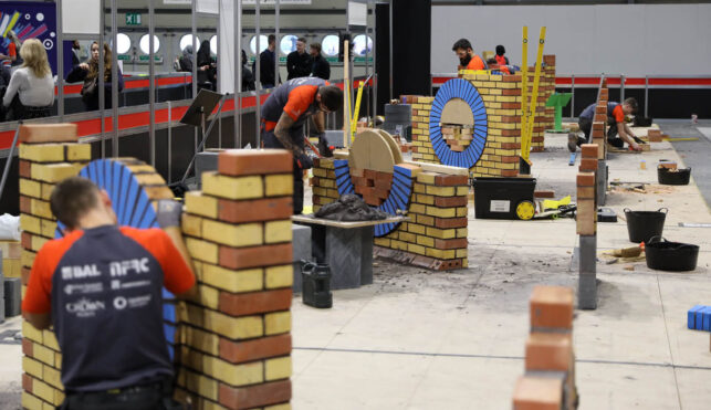Young people competing in Bricklaying competition