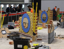 Young people competing in Bricklaying competition