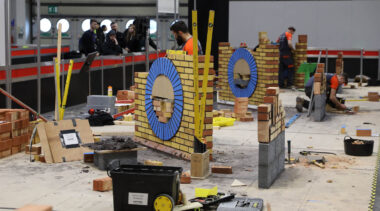 Young people competing in Bricklaying competition