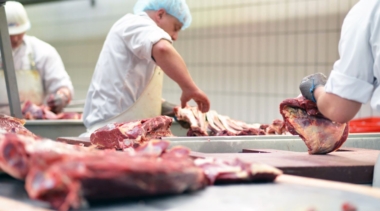 Photo of butchers preparing meat