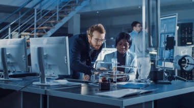 Photo of two CAD technicians examining a prototype