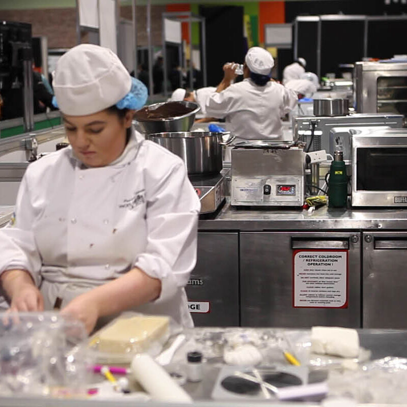 Young person competing in Confectionery & Patisserie competition