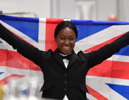 Photo of Restaurant Service competitor Elizabeth celebrating with the Union Jack