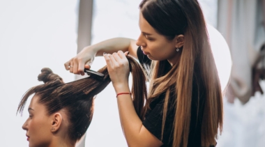 Photo of hairdresser cutting customer's hair