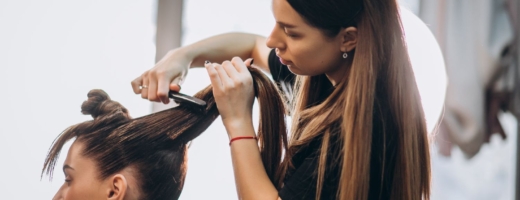 Photo of hairdresser cutting customer's hair