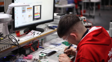 Young person competing in Industrial Electronics competition
