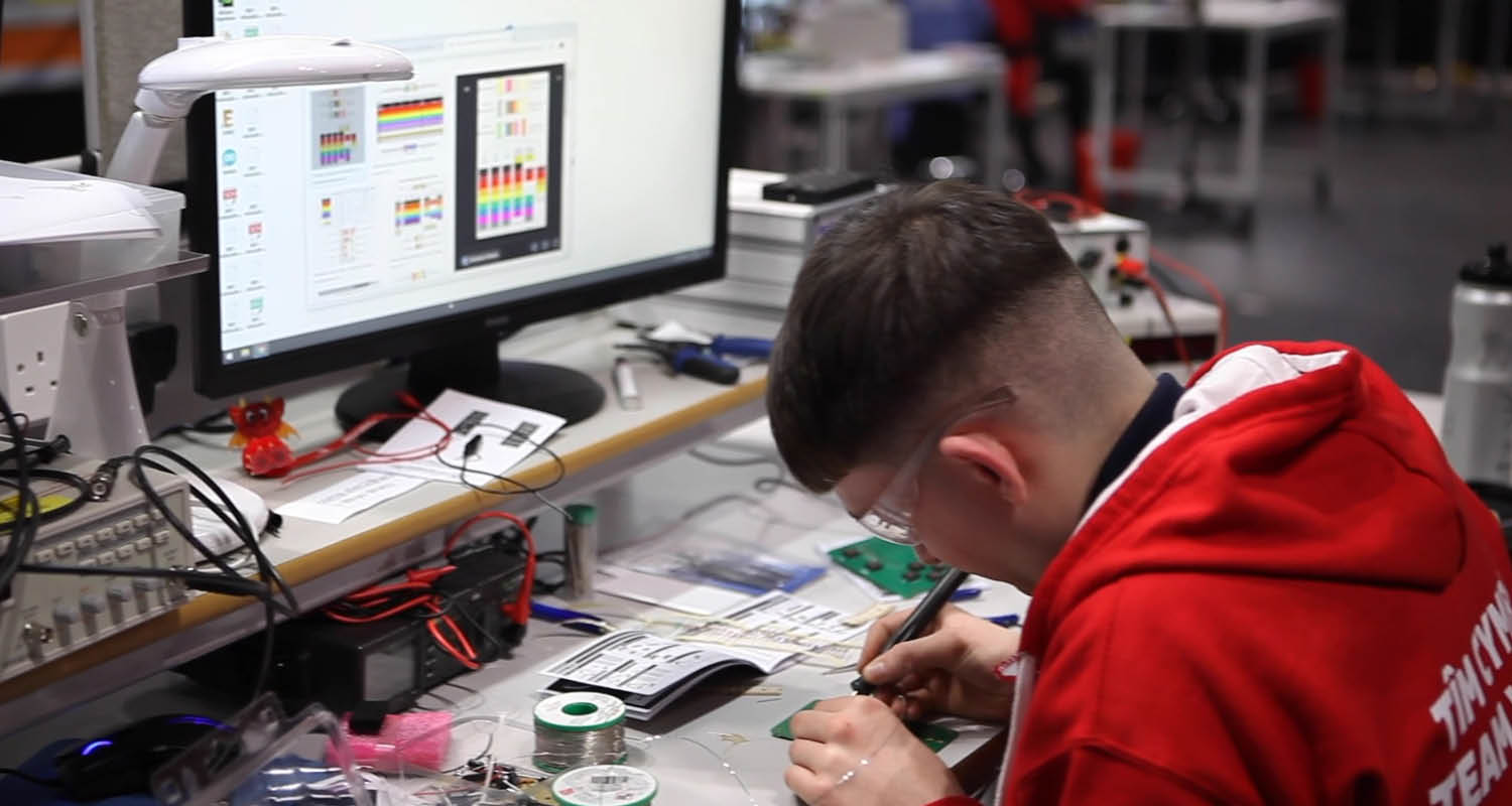 Young person competing in Industrial Electronics competition