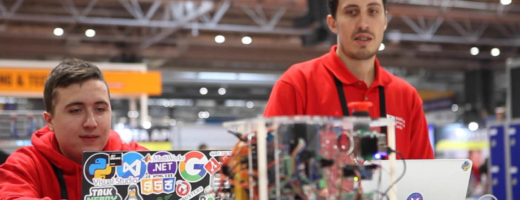 Young people competing in Industrial Robotics competition