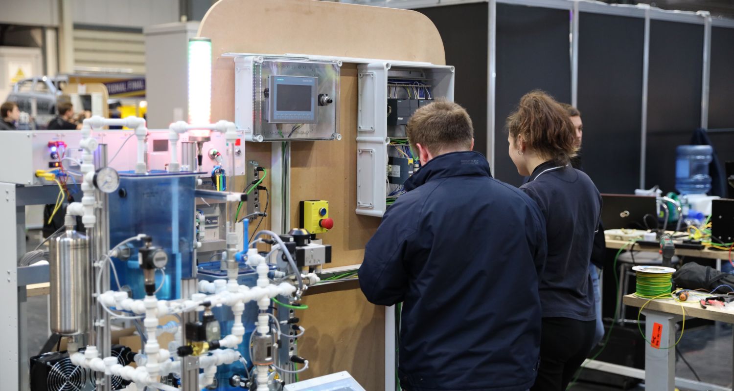 Young people competing in Industrial Control competition