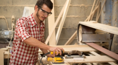 Photo of joiner sanding piece of wood