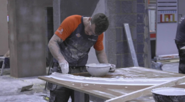 Young person competing in Plastering competition