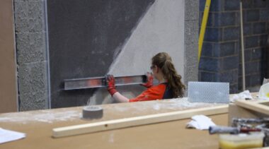 Young person competing in Plastering and Drywall Systems competition