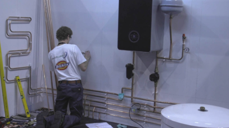 Young people competing in Plumbing competition