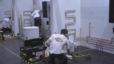 Young people competing in Plumbing competition