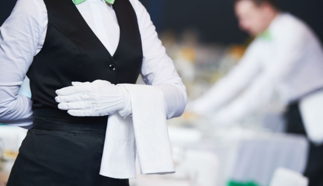 Photo of young waitress in a smart restaurant