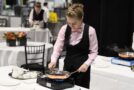 Young person competing in Restaurant Service competition