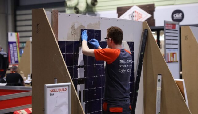 Young person competing in Wall and Floor Tiling competition