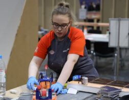 Young person competing in Wall and Floor Tiling competition