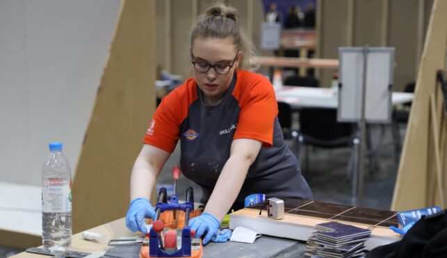 Young person competing in Wall and Floor Tiling competition