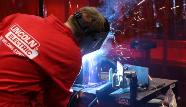 Young person competing in Welding competition