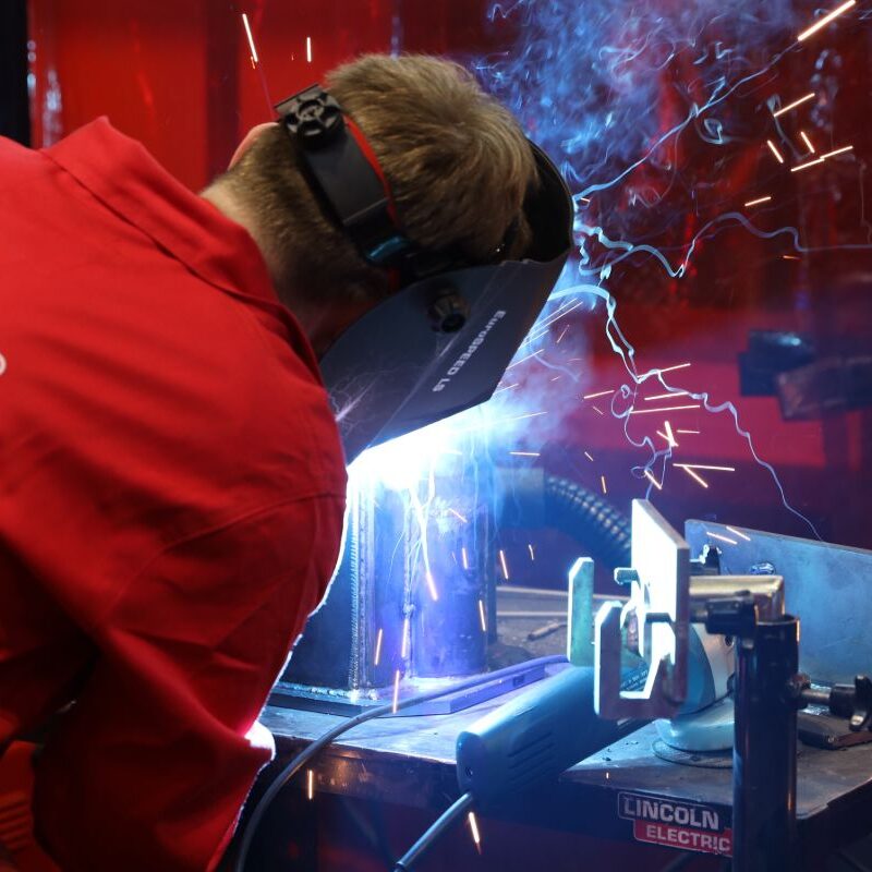 Young person competing in Welding competition